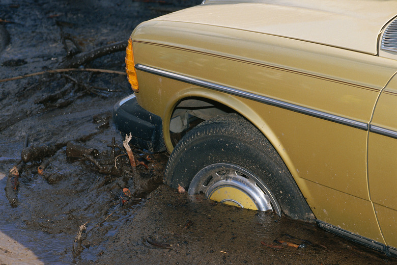 Shot of car hood stuck in deep mud