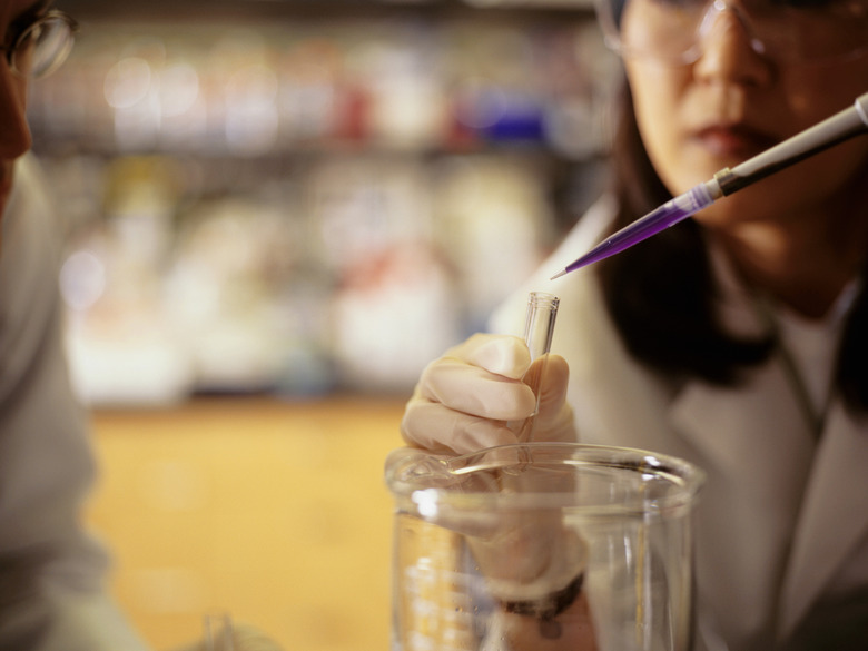 Female scientist conducting experiment in laboratory