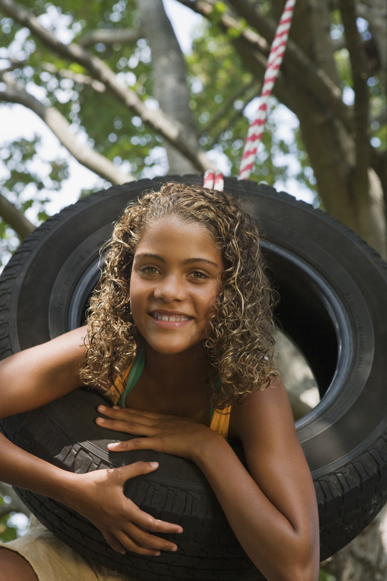 Girl on tire swing