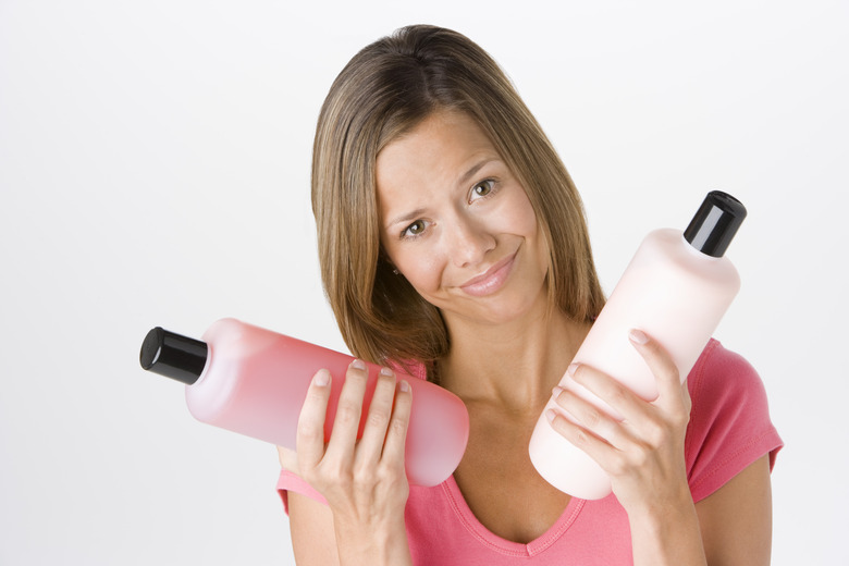 Woman with shampoo and conditioner