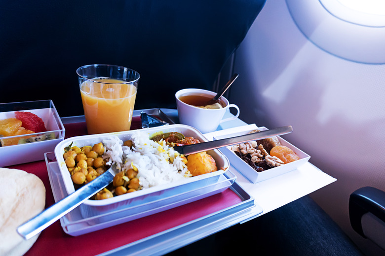 photo of Food served on board of economy class airplane on the table