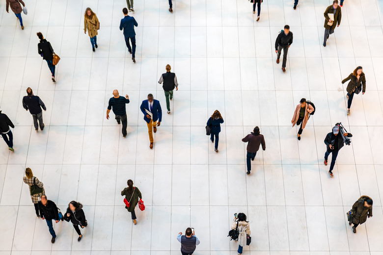 Top view people walking white floor or large crowd of anonymous people.