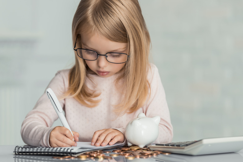 Little girl wearing count money