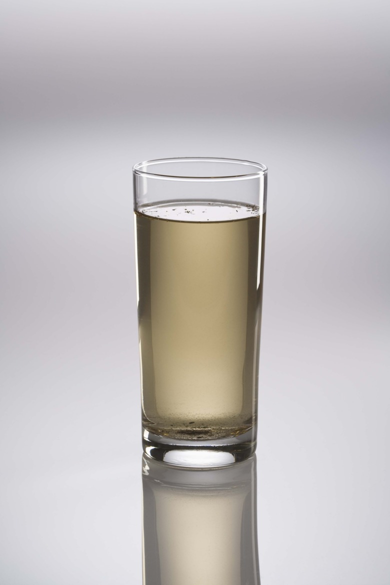 Glass of dirty water