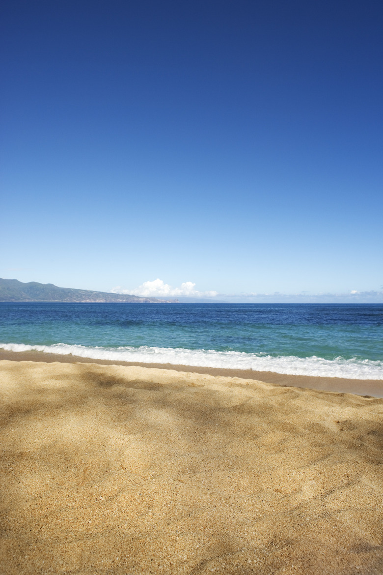 Air, land and ocean meet at the seashore.