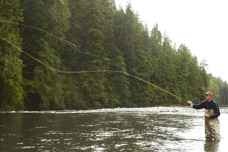 Man fly fishing in river 