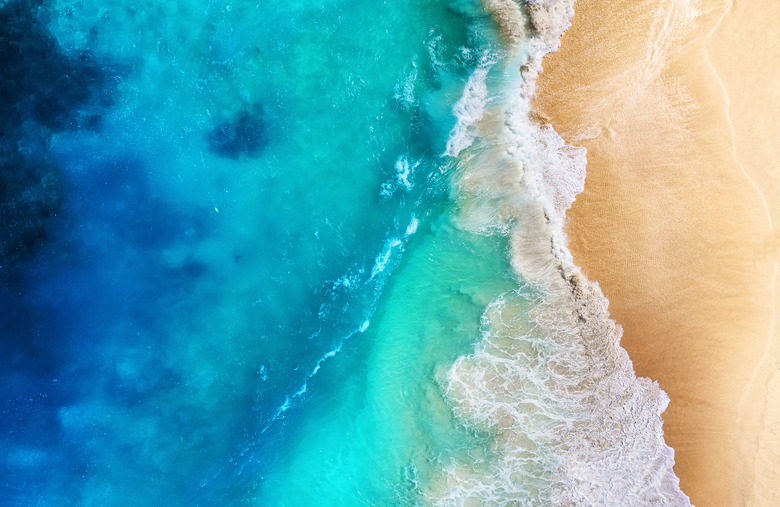 Coast and waves as a background from top view. Turquoise water background from top view. Summer seascape from air. Travel - image