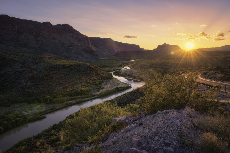 Landscape with winding river at sunset