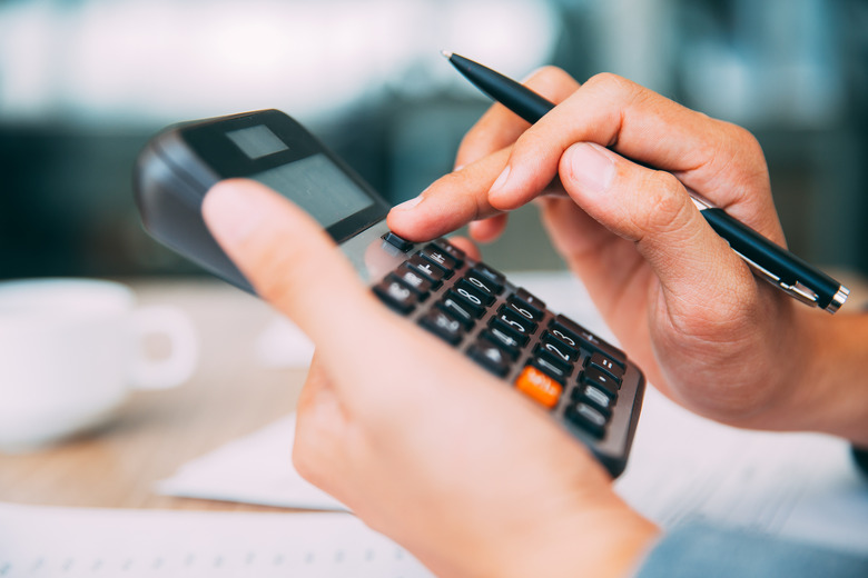 Male hands using calculator_tone