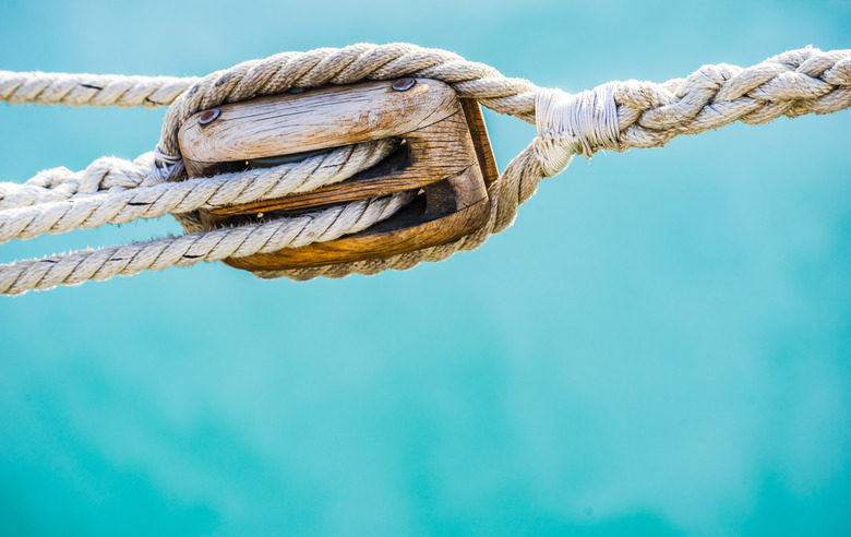 Sailing boat pulley, block and tackle with moored nautical rope