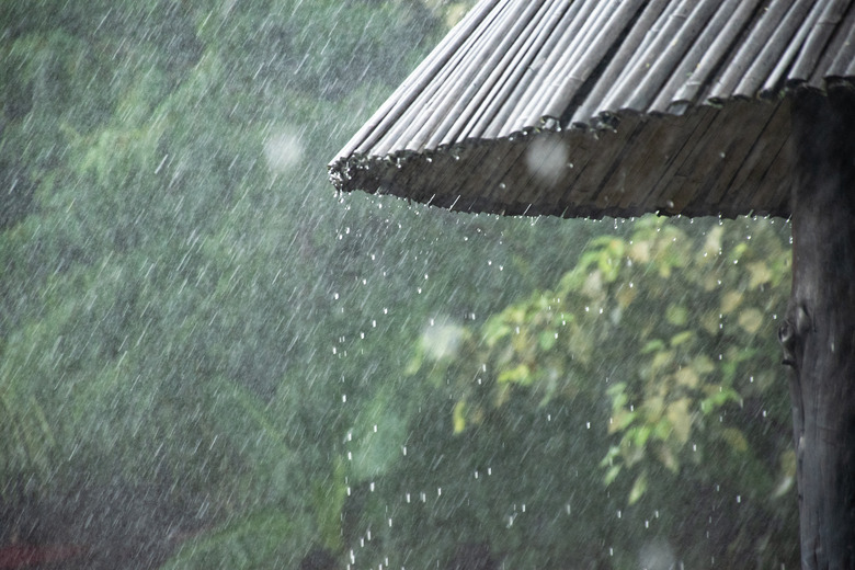 The rain drops from the roof of bamboo.