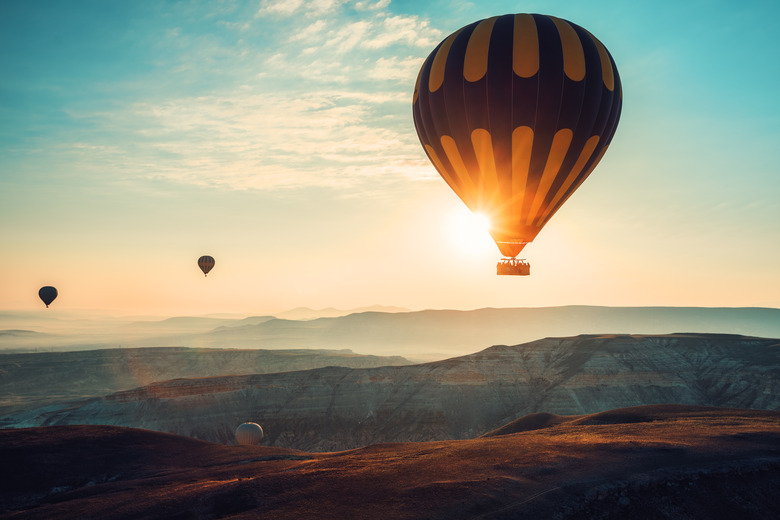 Hot air balloons flying over the valley at Cappadocia, Turkey