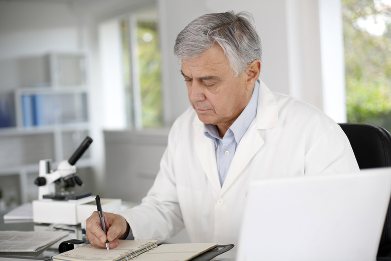 Biologist sitting in laboratory