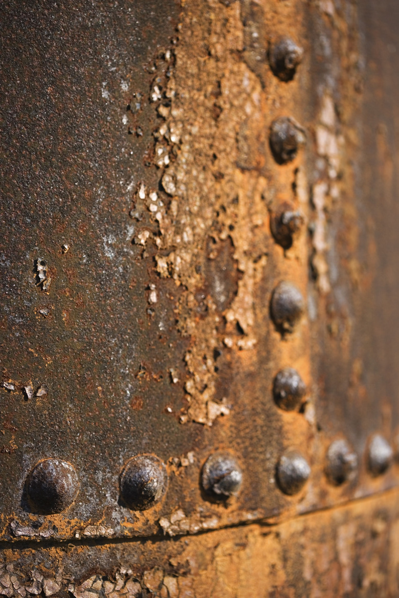 Rusted metal surface with rivets