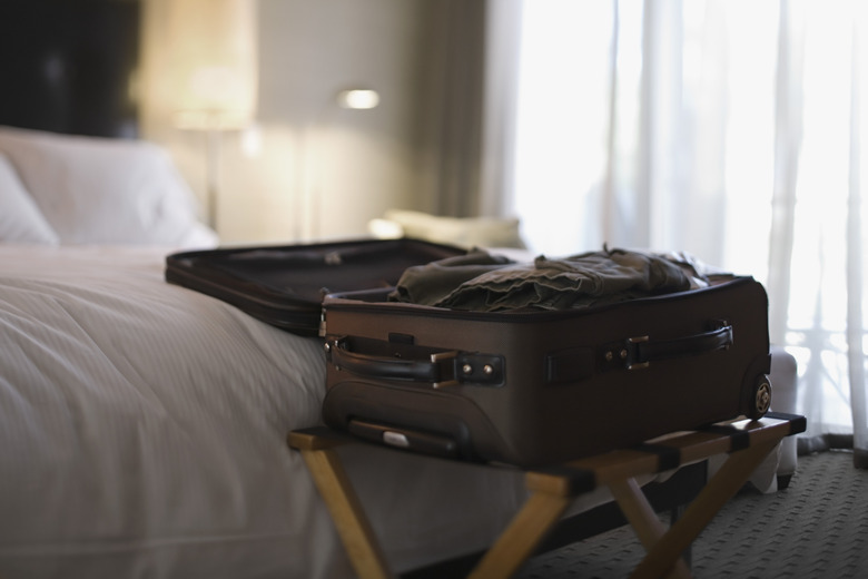 Open suitcase on bed