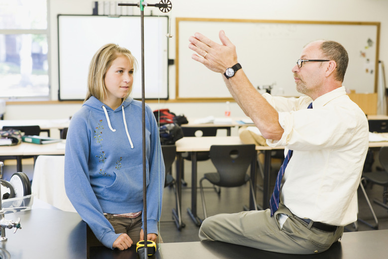 Professor explaining a student in a college laboratory