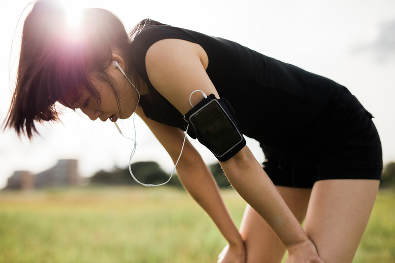 Sportswoman taking break from running workout.