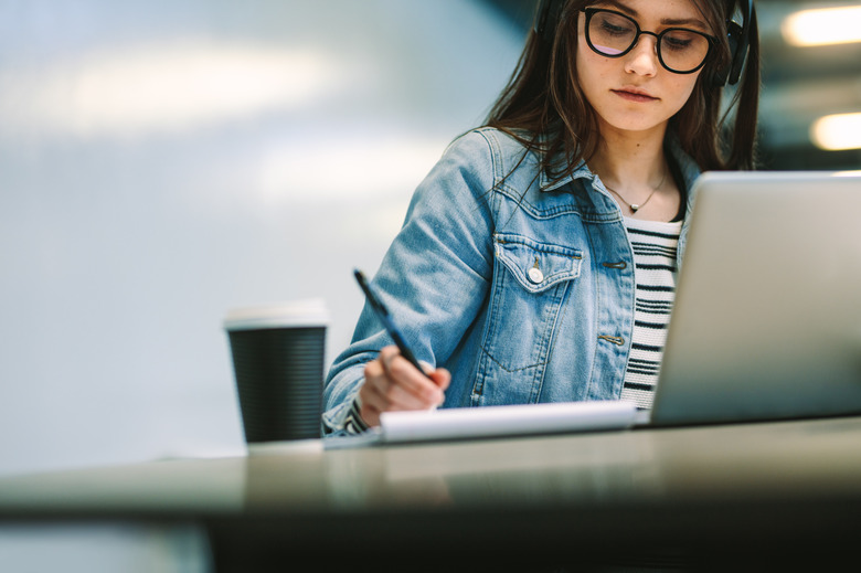 University student studying at library