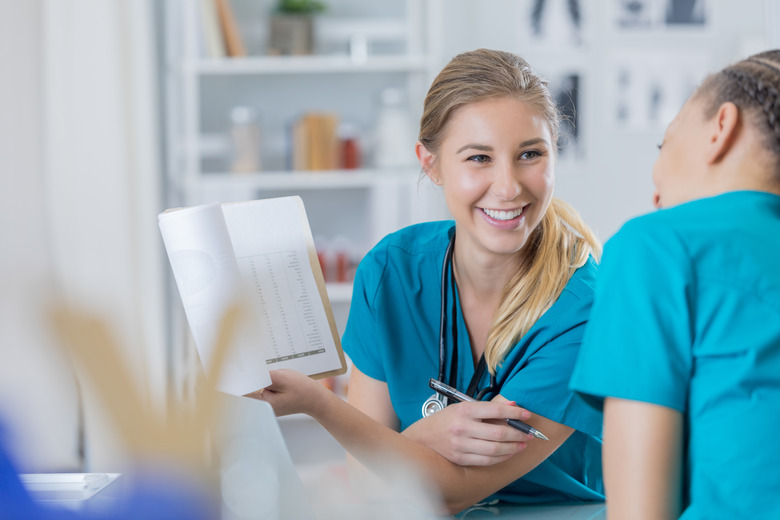 Cheerful physician talks with a colleague